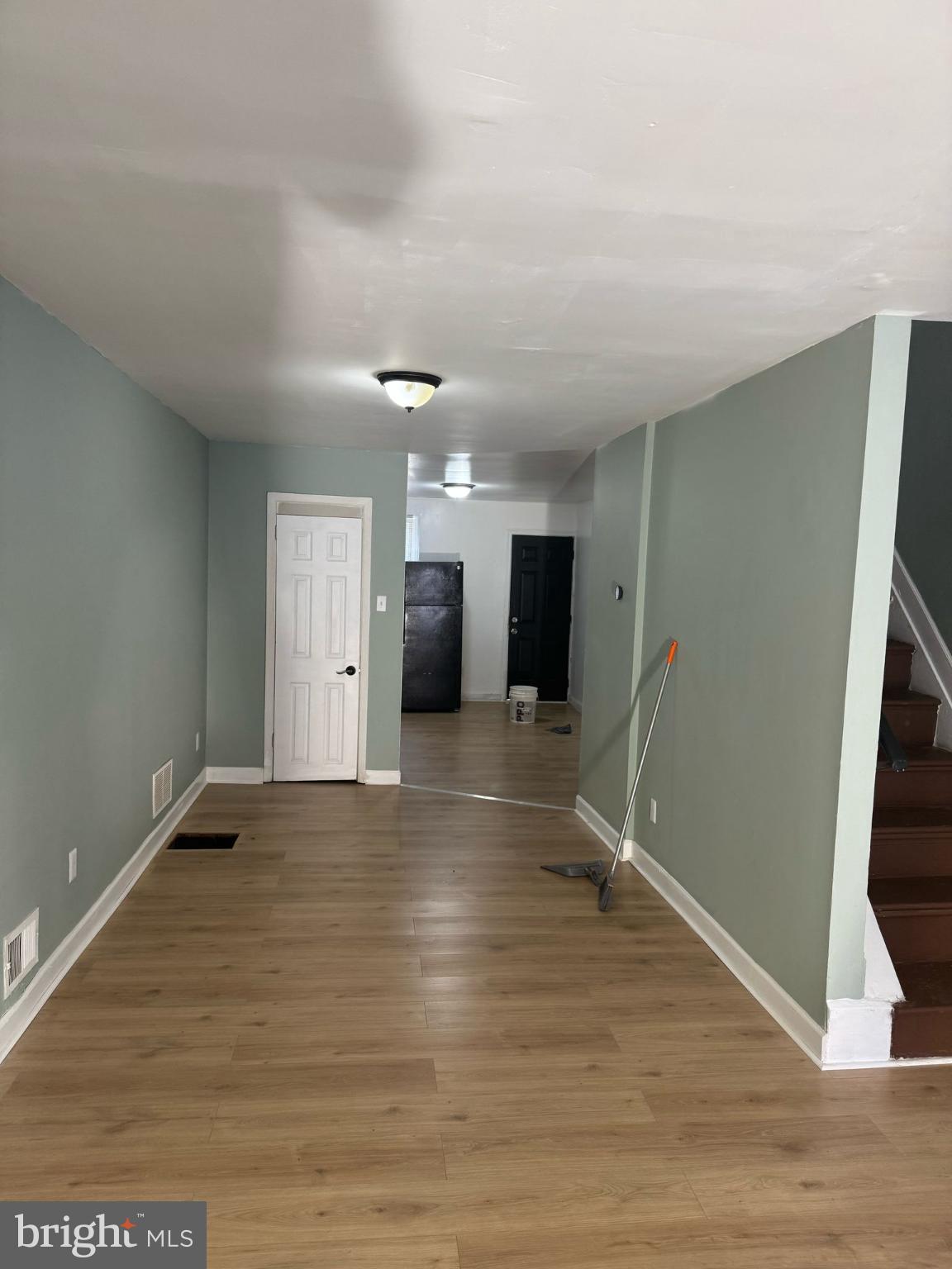 606 North Dukeland Street Baltimore, MD 21216 - Photo 2 of 11 a view of empty room with wooden floor