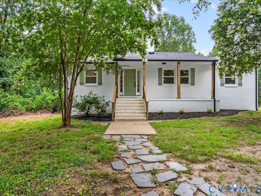 2291 Pony Farm Road Maidens, VA 23102 - Photo 1 of 43 a front view of a house with garden
