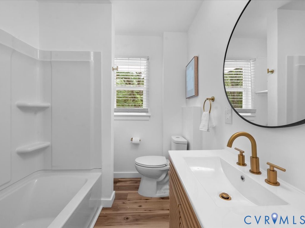 2291 Pony Farm Road Maidens, VA 23102 - Photo 14 of 43 a bathroom with a sink a toilet and a mirror