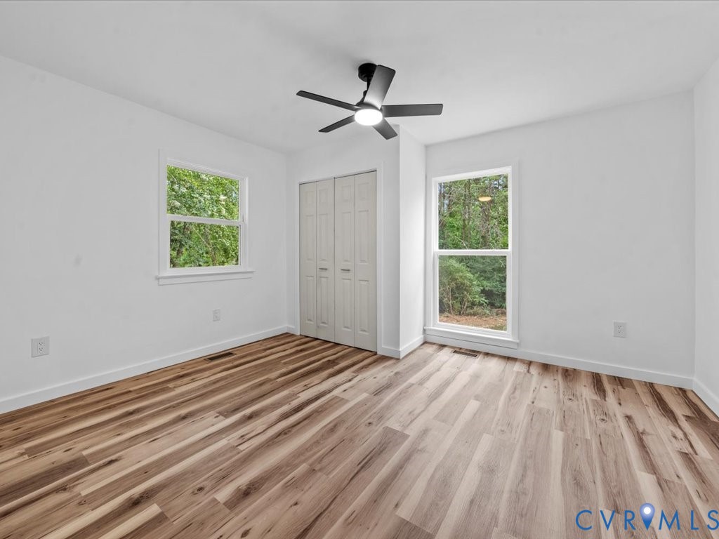 2291 Pony Farm Road Maidens, VA 23102 - Photo 18 of 43 a view of empty room with wooden floor and fan