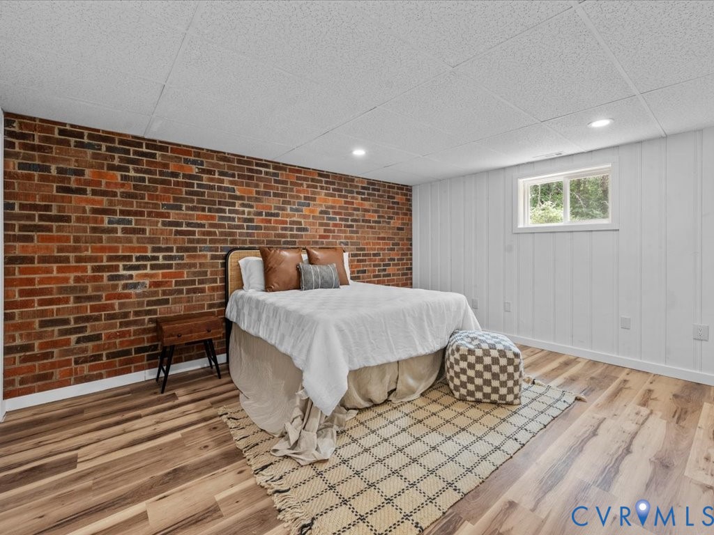 2291 Pony Farm Road Maidens, VA 23102 - Photo 38 of 43 a bedroom with a bed and wooden floor