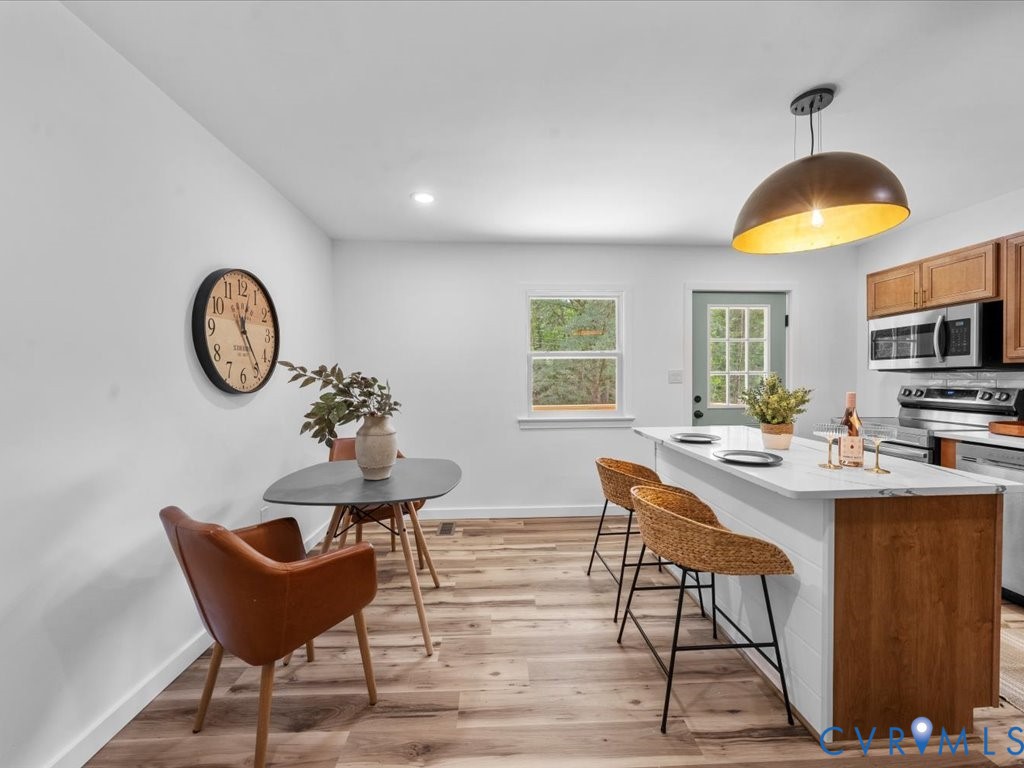 2291 Pony Farm Road Maidens, VA 23102 - Photo 8 of 43 a view of a kitchen with a table and chairs