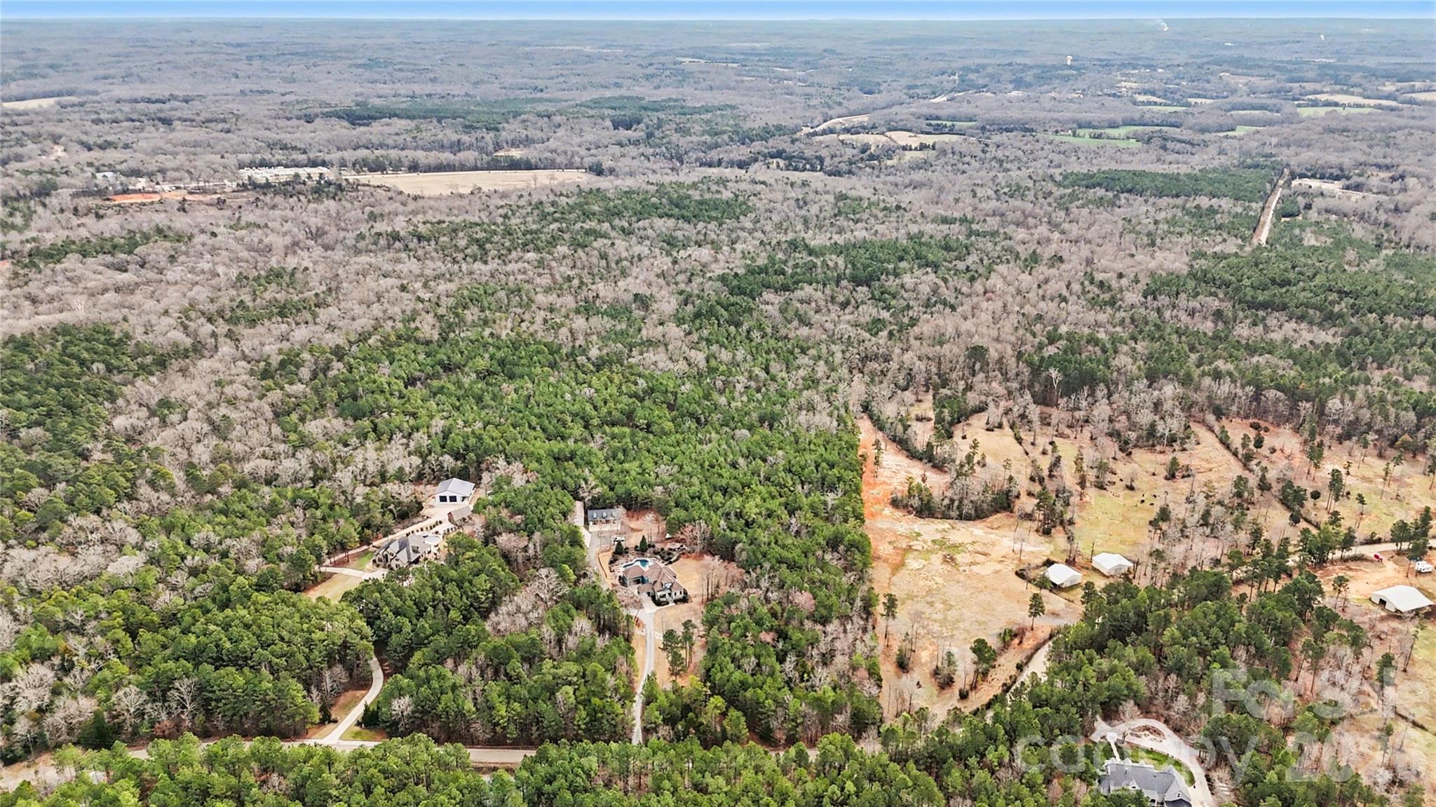 0 Three Crow Road, Unit D2B Lancaster, SC 29720 - Photo 8 of 13 an aerial view of house with yard and mountain in the back