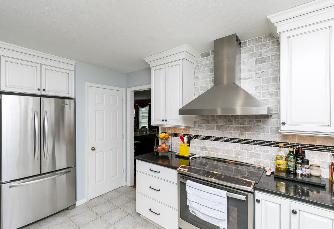 2289 Callis Road Lebanon, TN 37090 - Photo 4 of 20 a kitchen with granite countertop a refrigerator stove and sink
