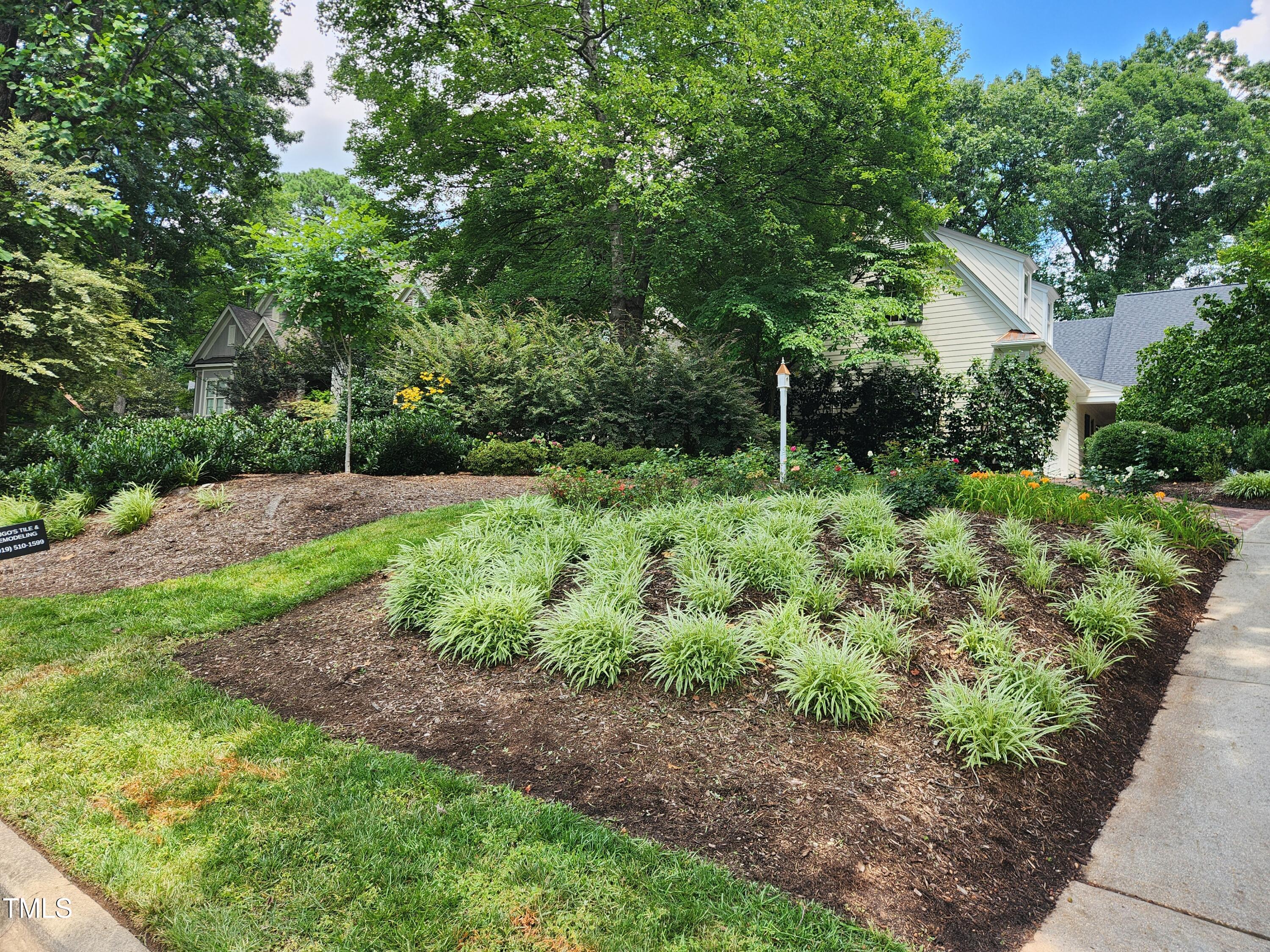 7516 Wingfoot Drive Raleigh, NC 27615 - Photo 11 of 34 a backyard of a house with lots of green space