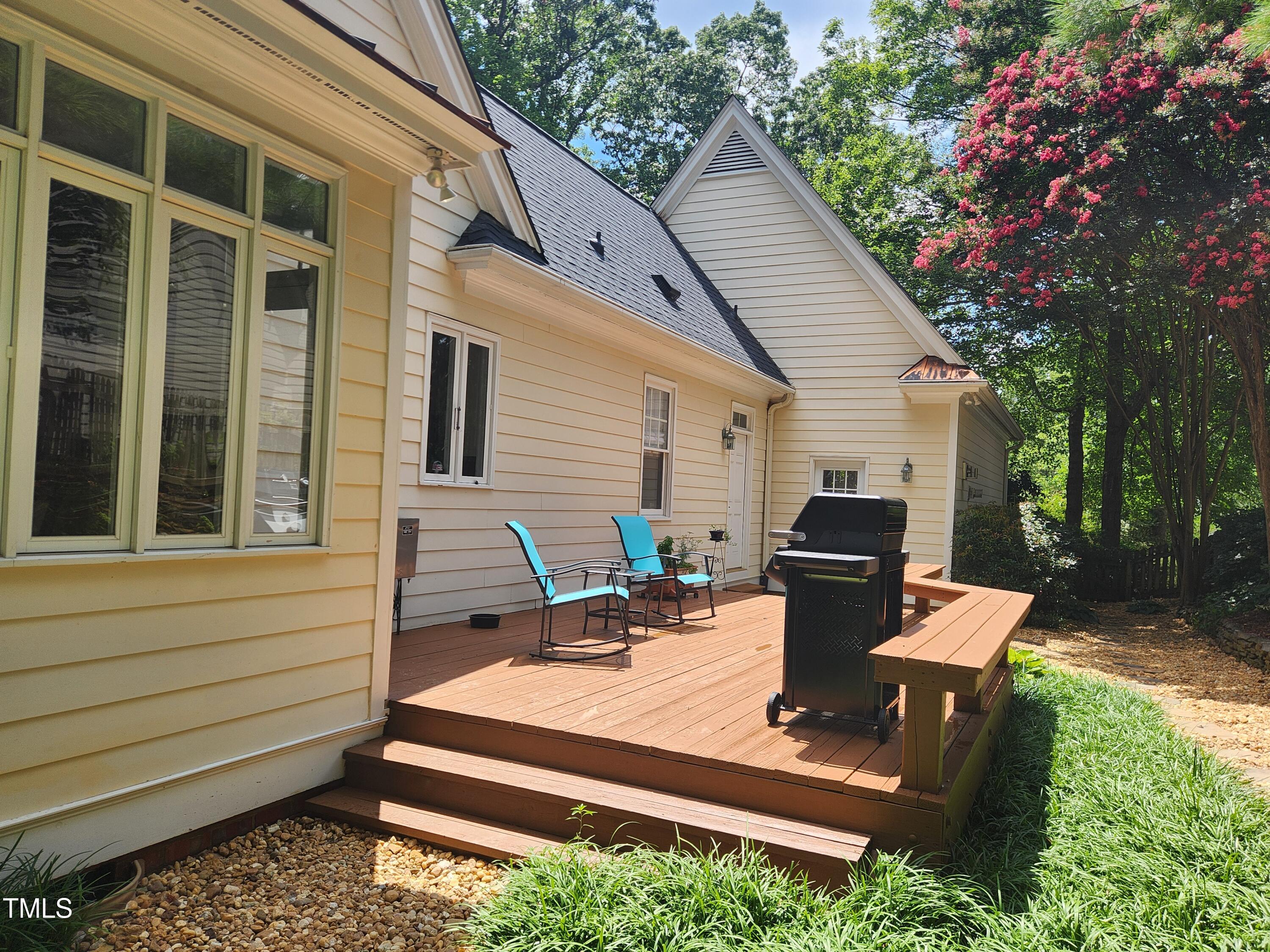 7516 Wingfoot Drive Raleigh, NC 27615 - Photo 13 of 34 a backyard of a house with seating space