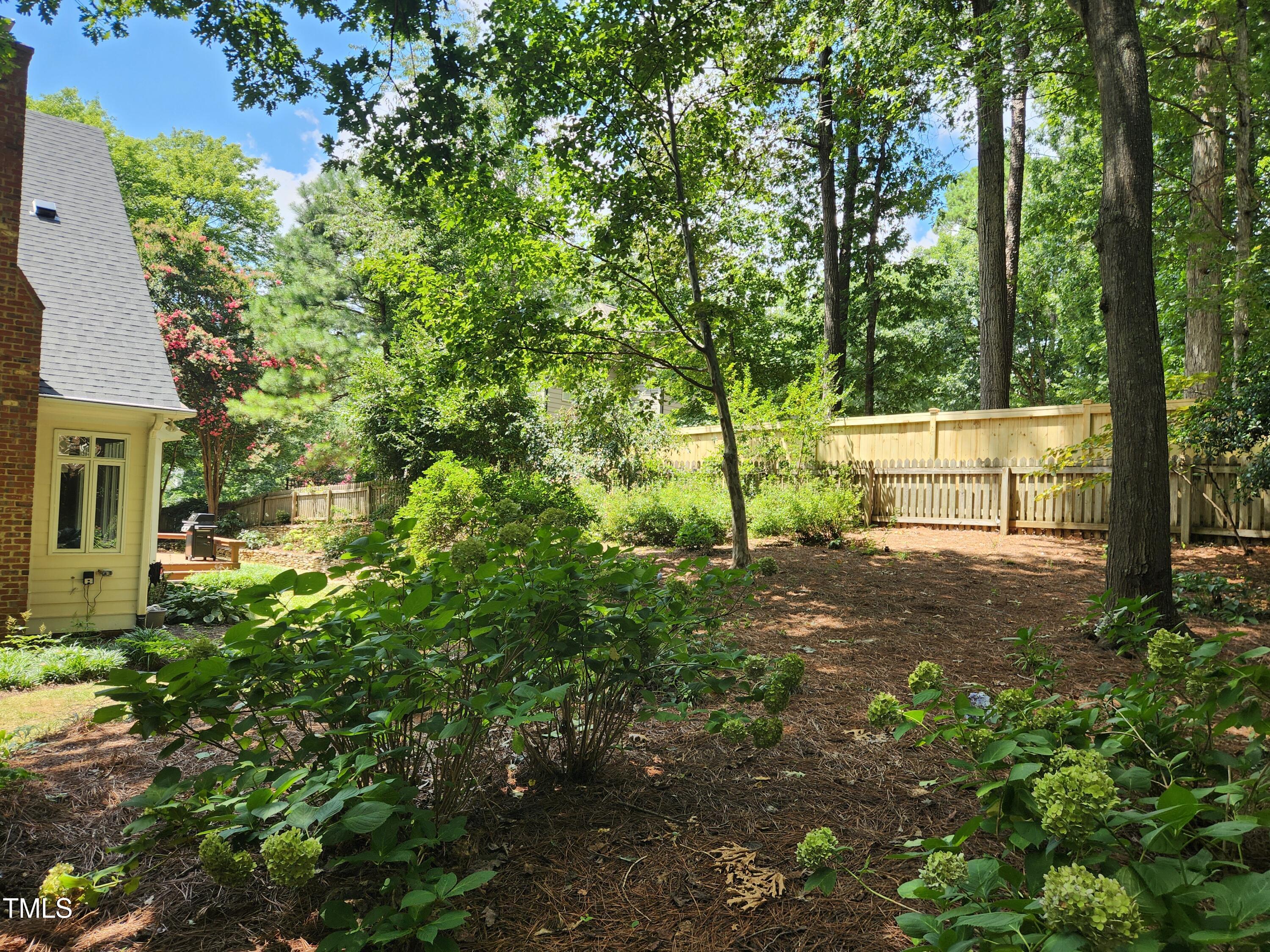 7516 Wingfoot Drive Raleigh, NC 27615 - Photo 17 of 34 a view of backyard with green space