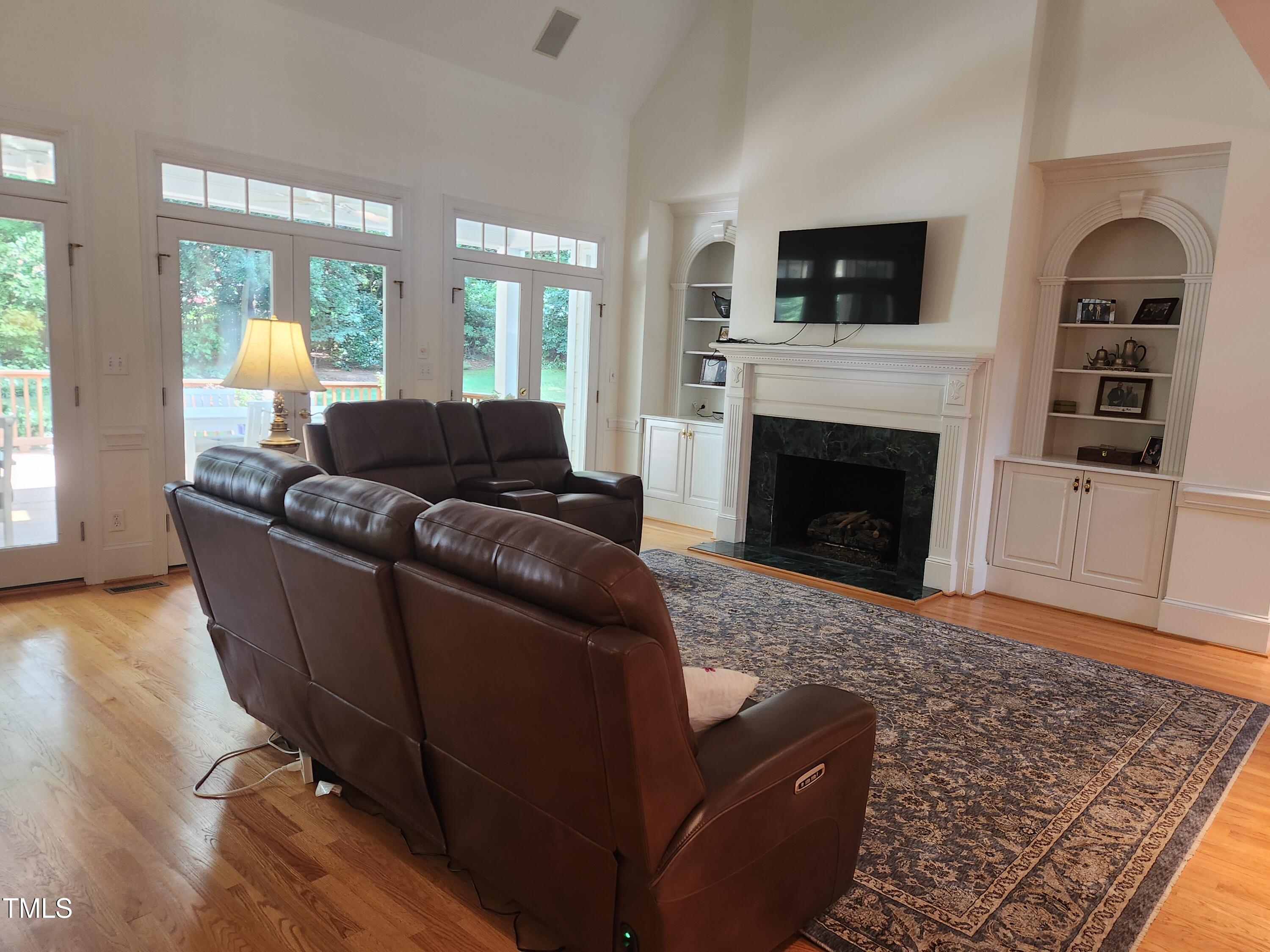 7516 Wingfoot Drive Raleigh, NC 27615 - Photo 18 of 34 a living room with furniture and a fireplace