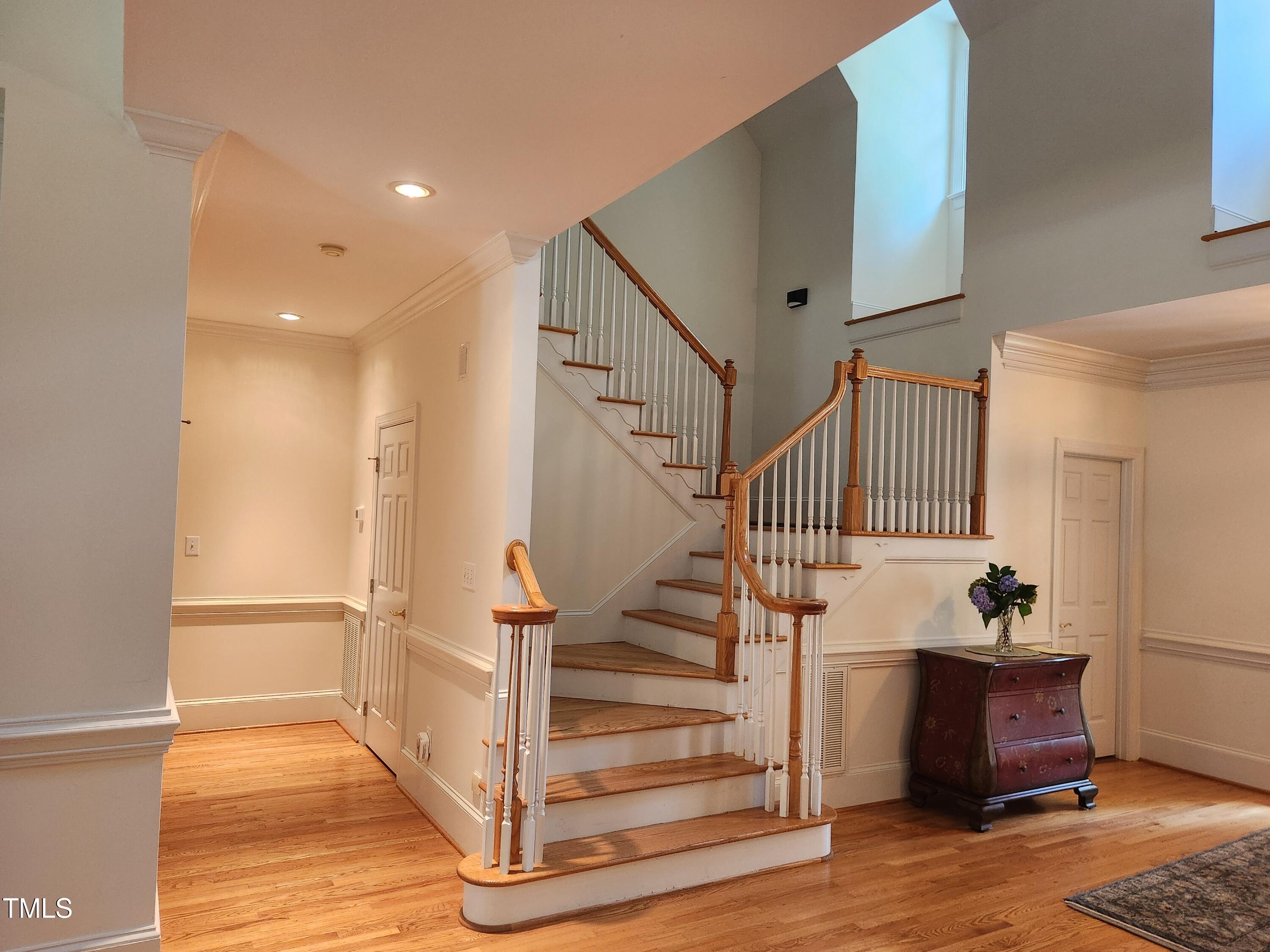 7516 Wingfoot Drive Raleigh, NC 27615 - Photo 19 of 34 a view of entryway and hall with wooden floor