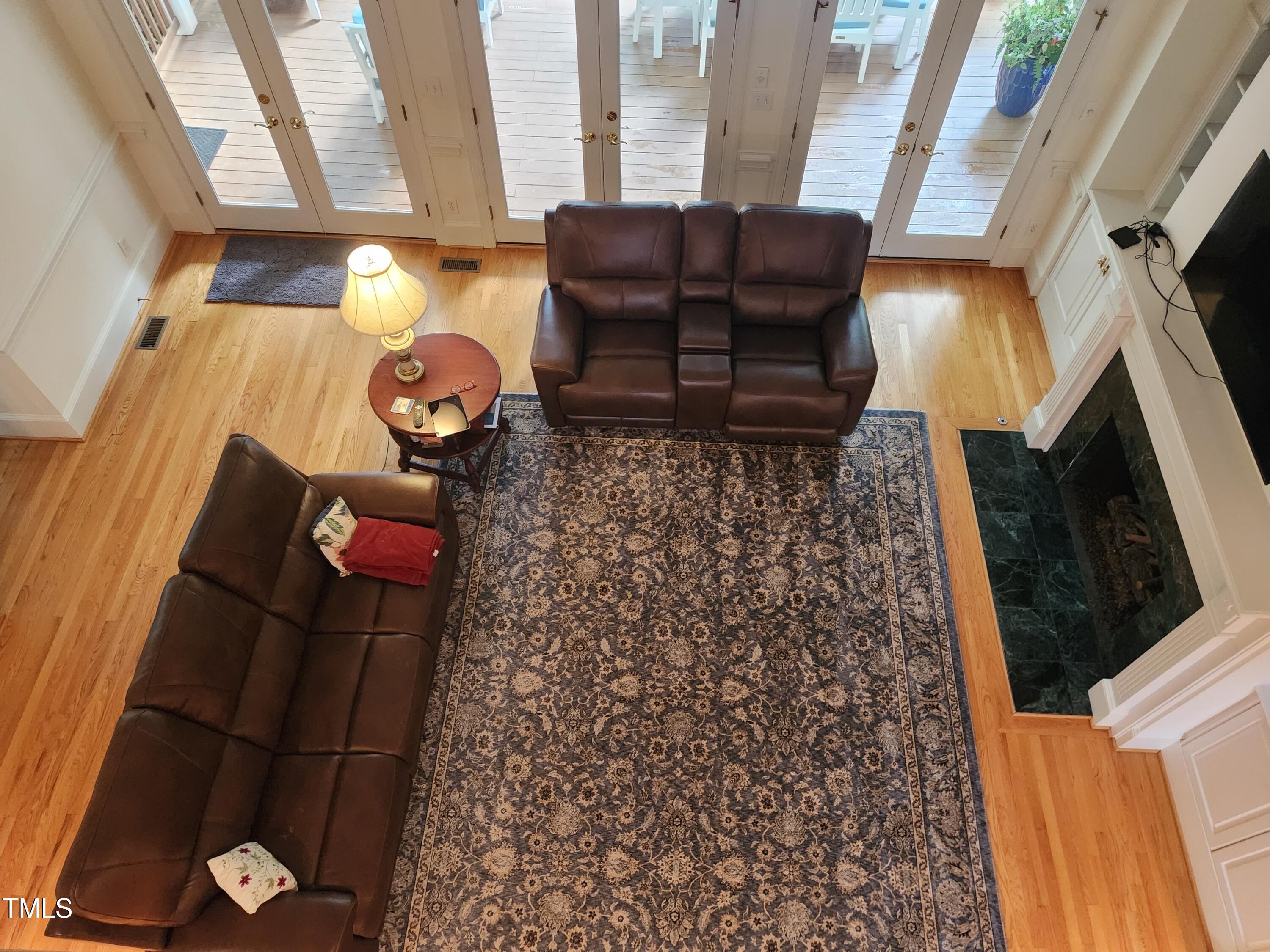 7516 Wingfoot Drive Raleigh, NC 27615 - Photo 24 of 34 a living room with furniture and a fireplace
