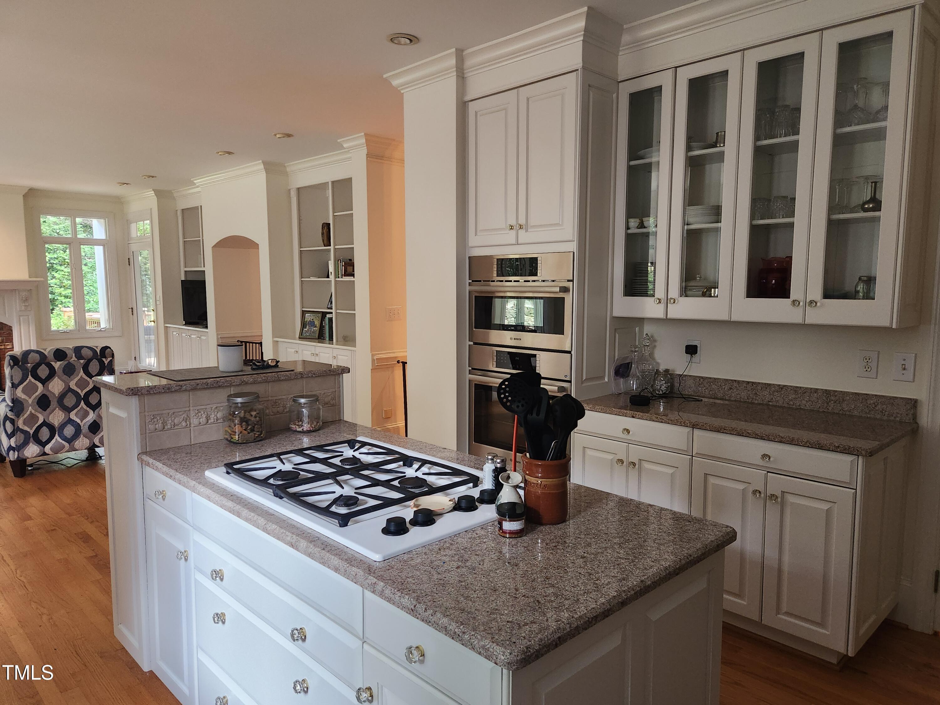7516 Wingfoot Drive Raleigh, NC 27615 - Photo 29 of 34 a kitchen with stainless steel appliances granite countertop a stove a sink and a granite counter tops