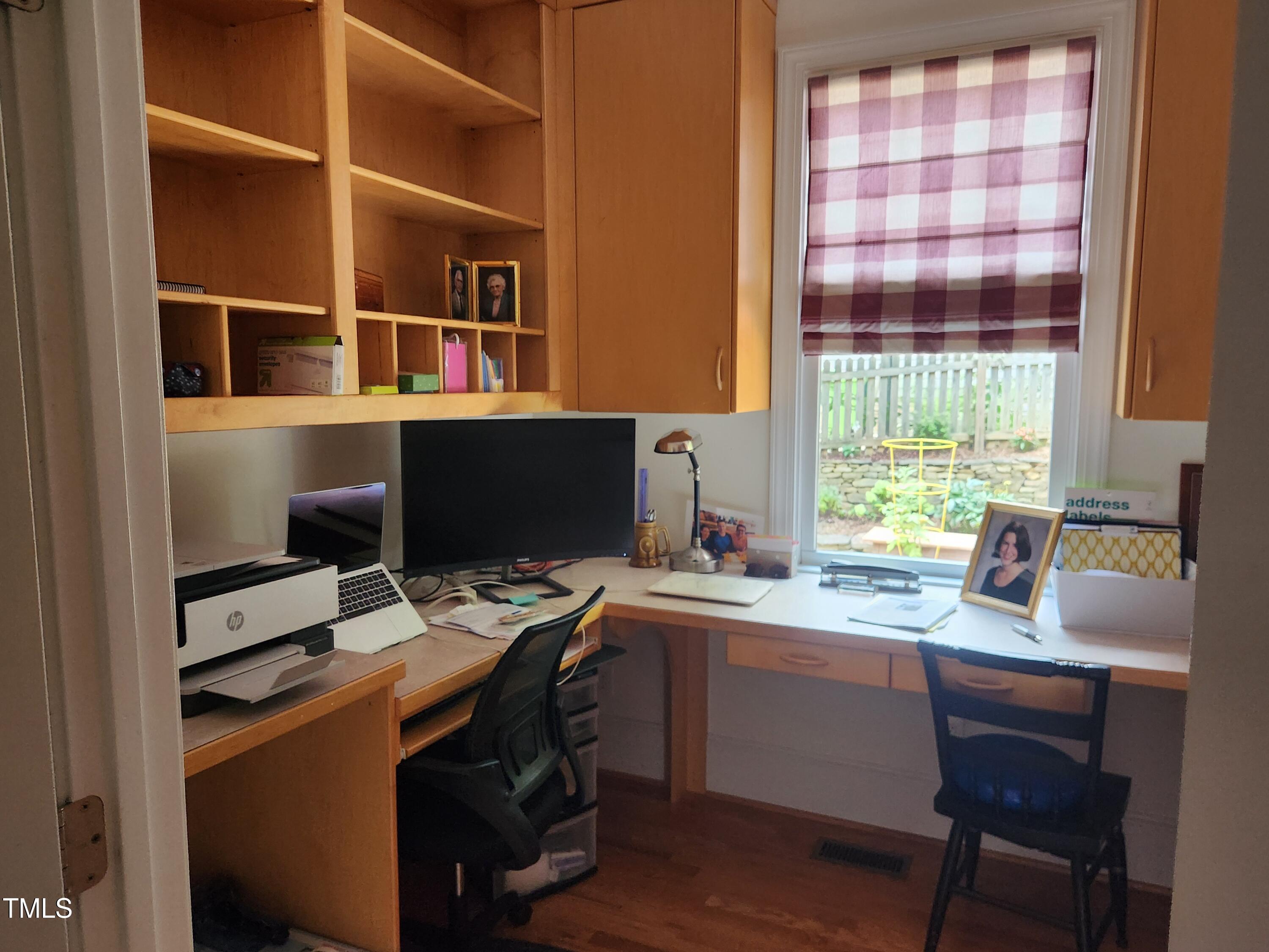 7516 Wingfoot Drive Raleigh, NC 27615 - Photo 30 of 34 a view of a workspace with furniture and a window