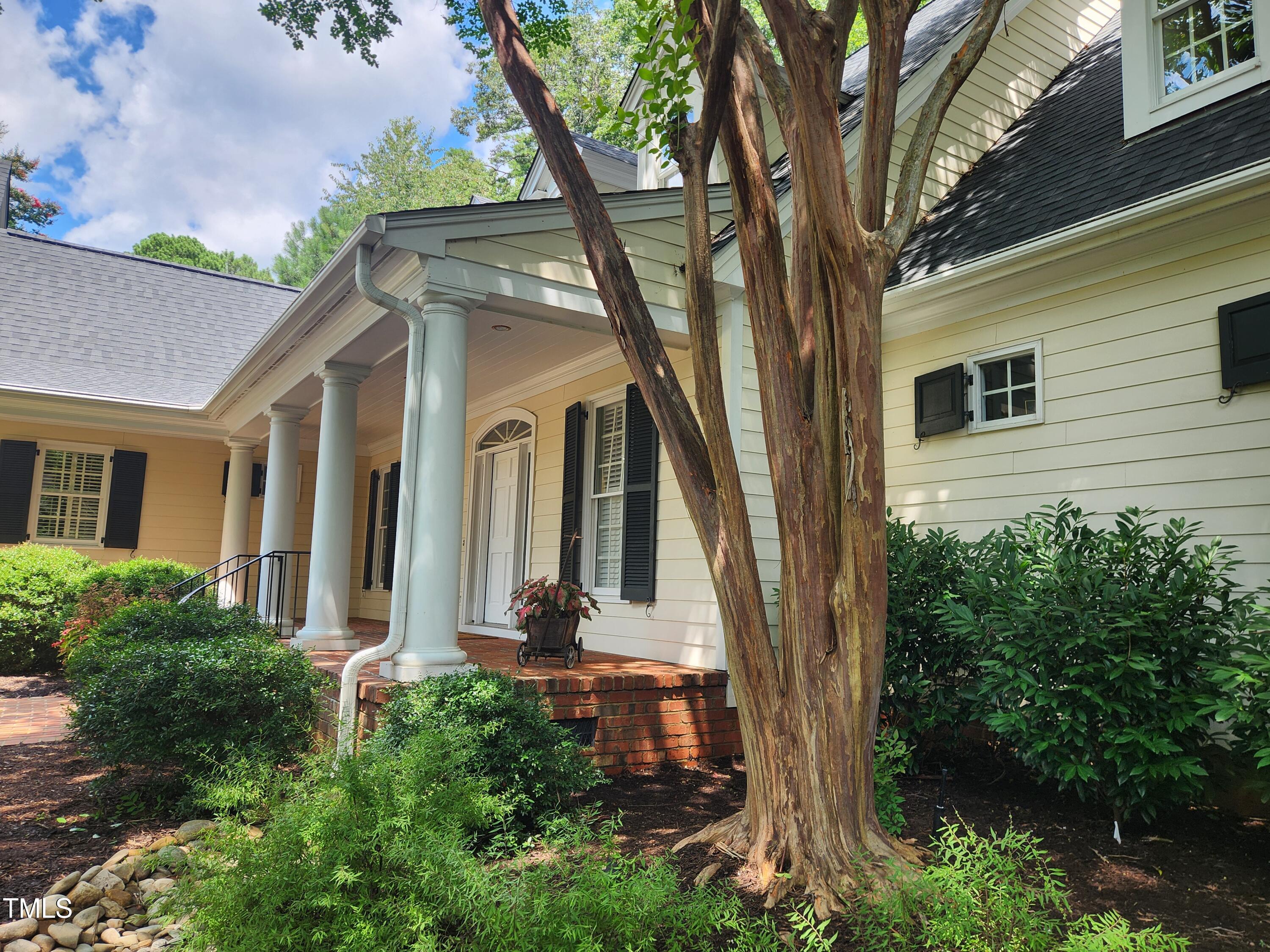 7516 Wingfoot Drive Raleigh, NC 27615 - Photo 3 of 34 front view of a house with a tree