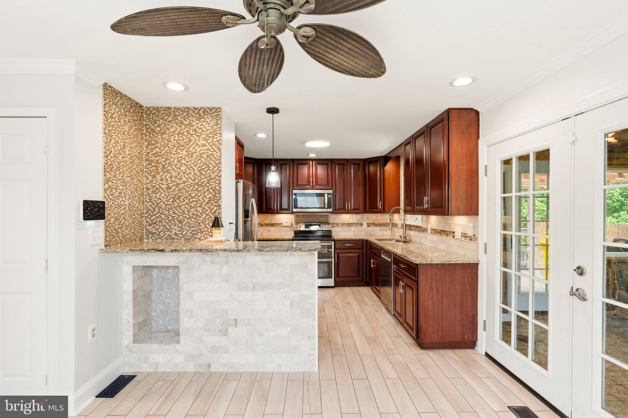 7845 Metacomet Road Hanover, MD 21076 - Photo 9 of 19 Modern kitchen with elegant finishes.