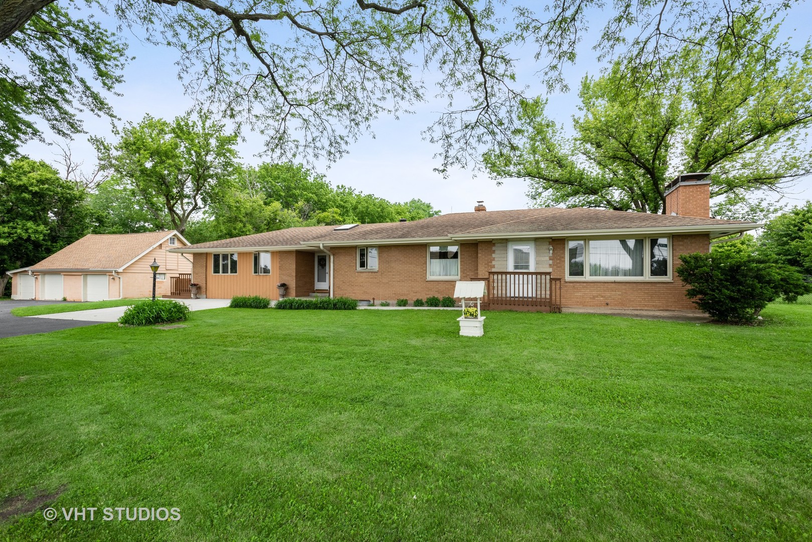 36W930 Bowes Road Elgin, IL 60124 - Photo 1 of 38 a front view of a house with a garden