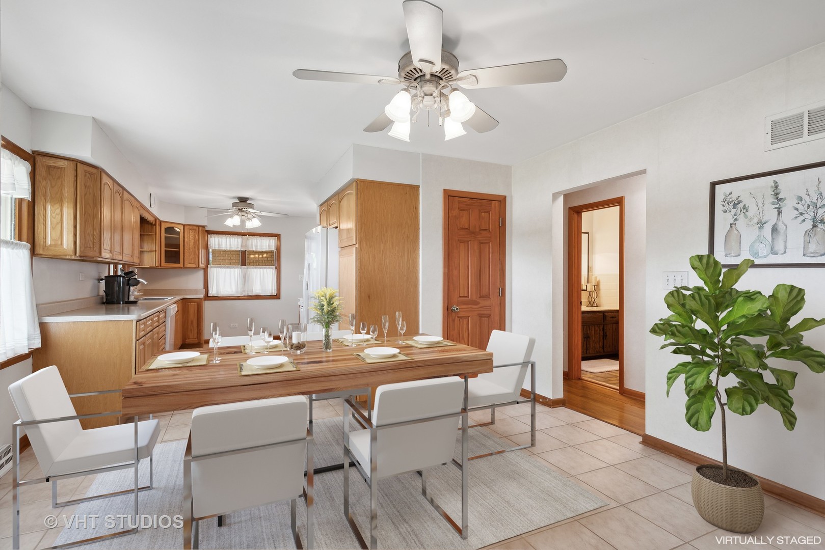 36W930 Bowes Road Elgin, IL 60124 - Photo 9 of 38 a dining room with furniture and a potted plant