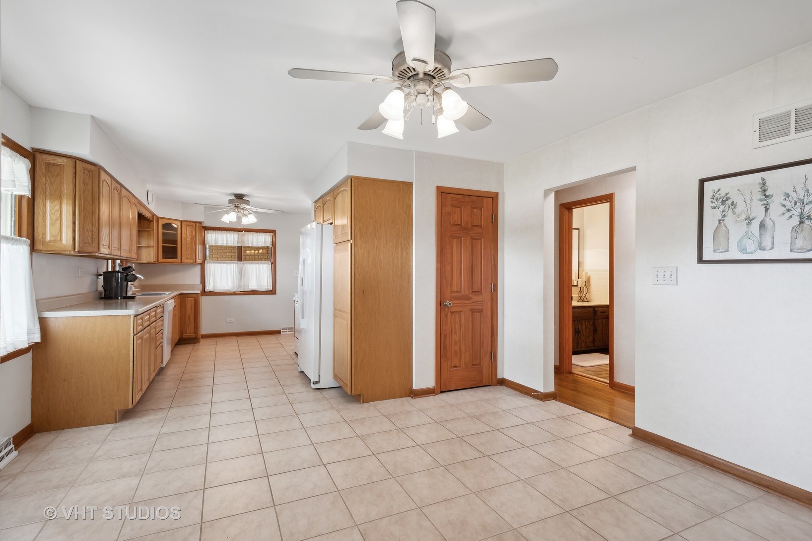 36W930 Bowes Road Elgin, IL 60124 - Photo 10 of 38 a view of a kitchen with furniture and an empty room