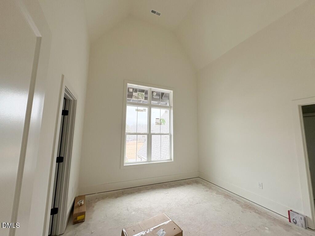 5816 Carriage Drive Raleigh, NC 27603 - Photo 10 of 14 an empty room with windows