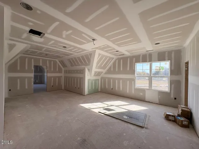 a view of an empty room with windows