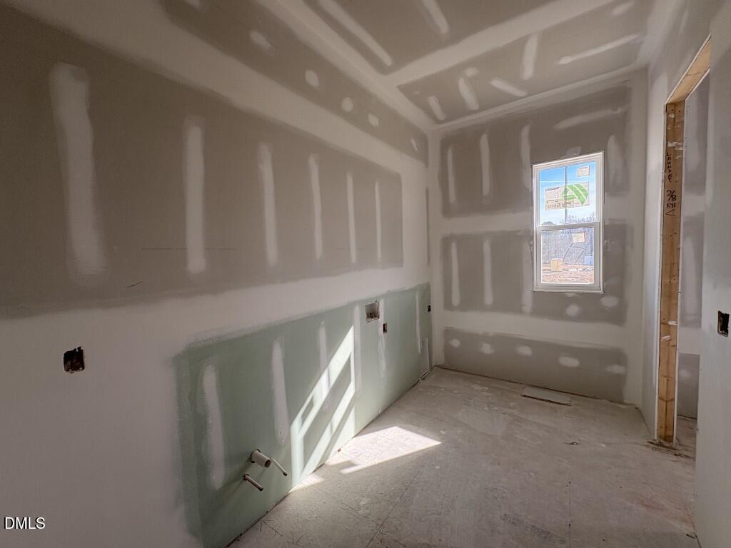 5816 Carriage Drive Raleigh, NC 27603 - Photo 13 of 13 a view of an empty room with a window