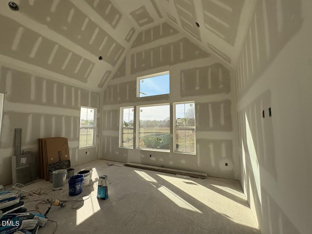 5816 Carriage Drive Raleigh, NC 27603 - Photo 4 of 13 a view of a livingroom with furniture and staircase