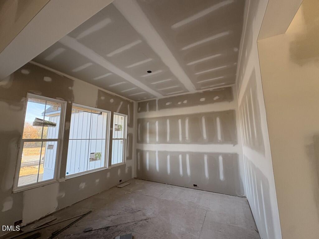 5816 Carriage Drive Raleigh, NC 27603 - Photo 5 of 13 a view of an empty room with a window