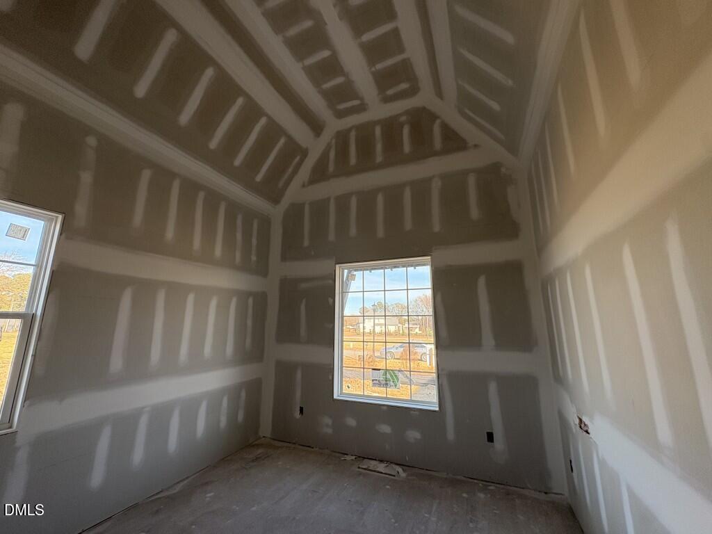 5816 Carriage Drive Raleigh, NC 27603 - Photo 6 of 13 a view of an empty room with a window