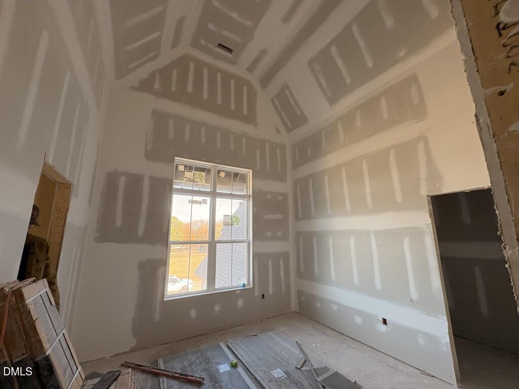 5816 Carriage Drive Raleigh, NC 27603 - Photo 8 of 13 a view of an empty room with a window
