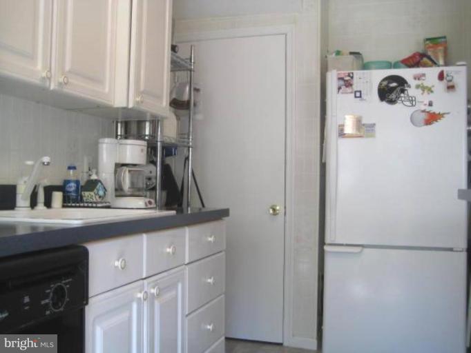 2248 Southorn Road Middle River, MD 21220 - Photo 17 of 21 a kitchen with a refrigerator and cabinets