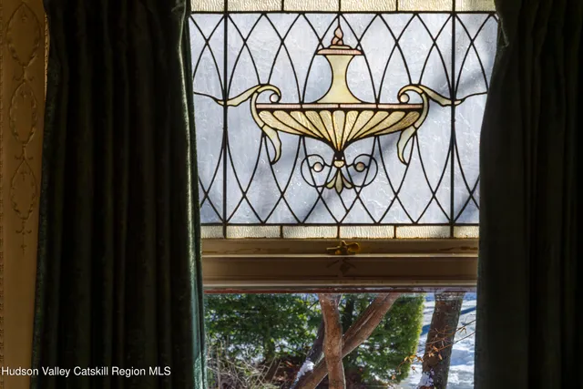 a dining room with table and chairs