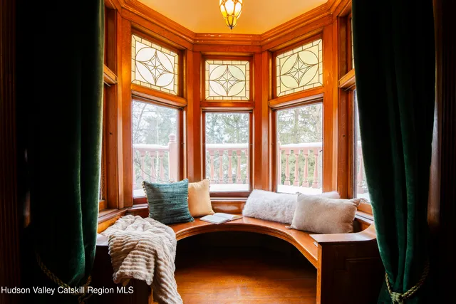 a dining room with furniture and window