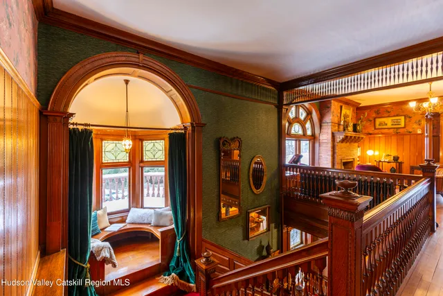 a view of a livingroom with furniture and hardwood floor