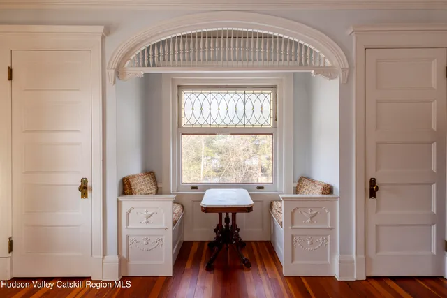 a bathroom with a bathtub and a window