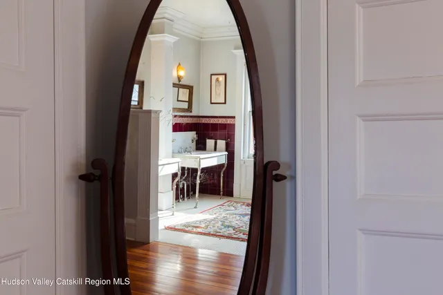 a view of living room with furniture and a fireplace