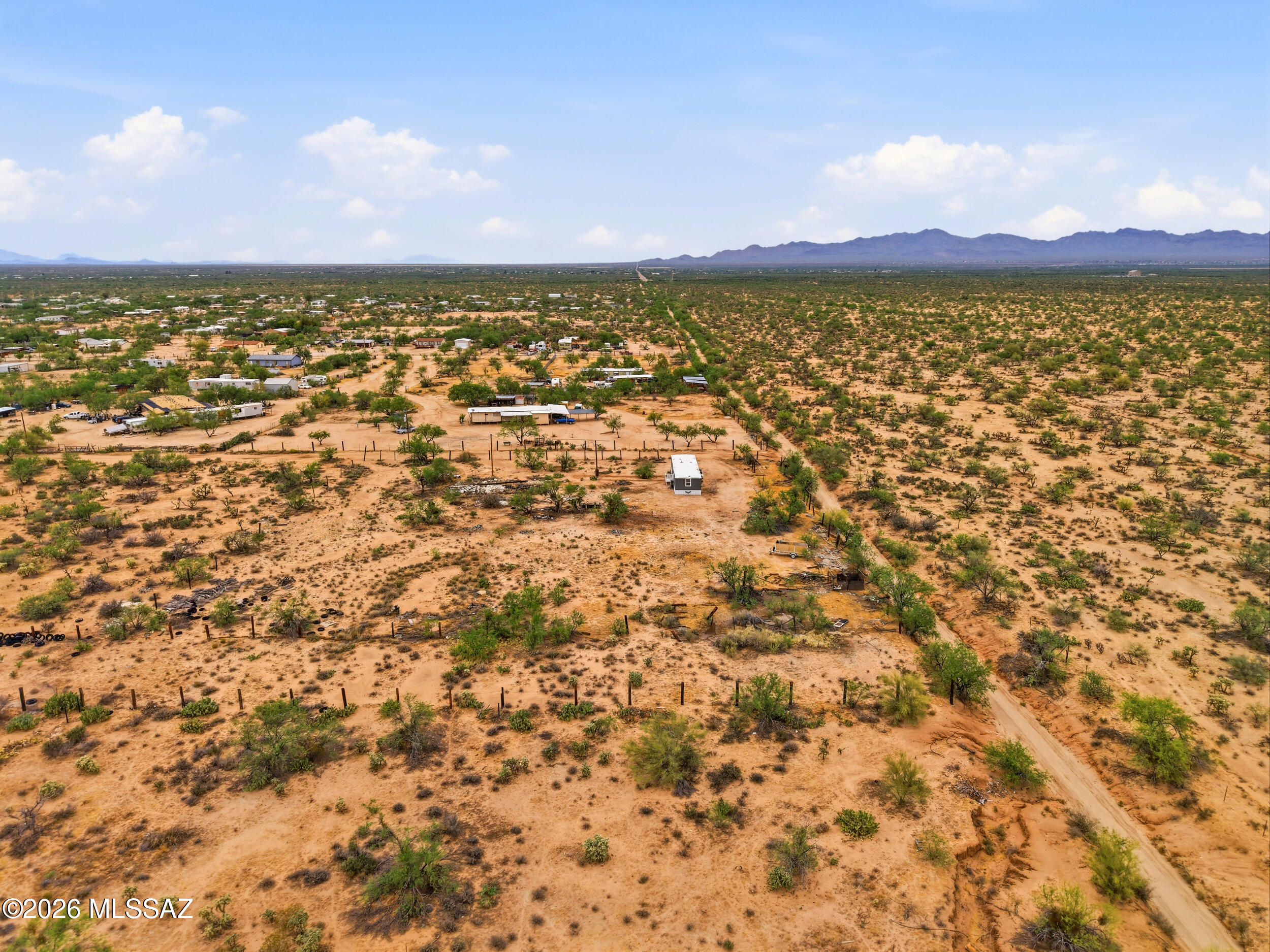 8620 South Sandario Road Tucson, AZ 85736 - Photo 21 of 26 an aerial view of residential houses with outdoor space and trees