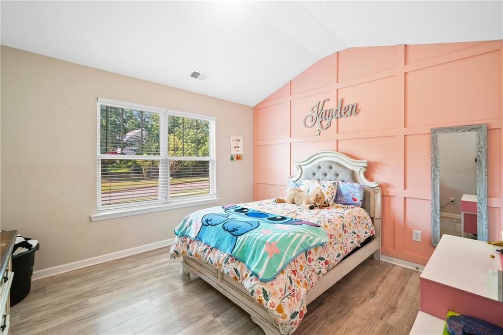 13 Four Feathers Lane Northeast Rydal, GA 30171 - Photo 40 of 51 a bedroom with a bed and a window