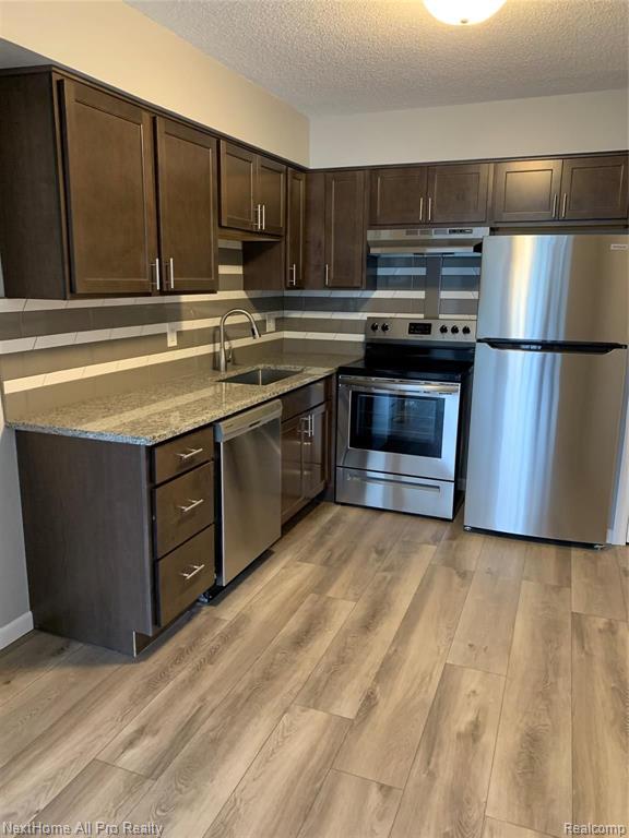 1252-unit #2 East West Maple Road Walled Lake, MI 48390 - Photo 1 of 15