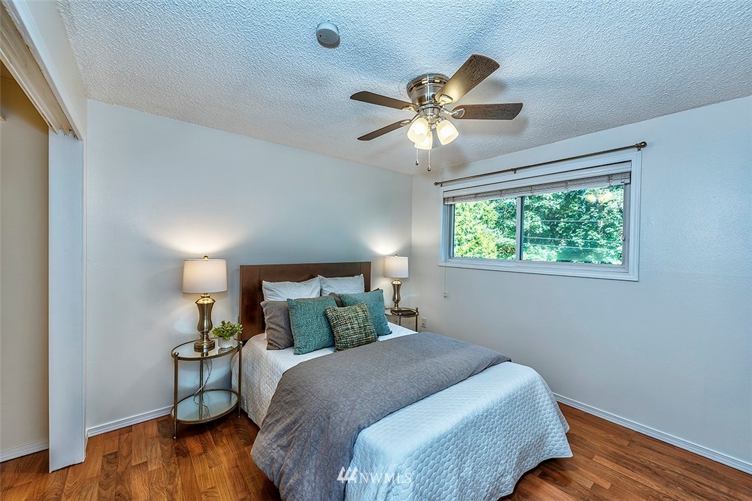 23002 Atlas Road Bothell, WA 98021 - Photo 14 of 23 a bedroom with a bed and a window