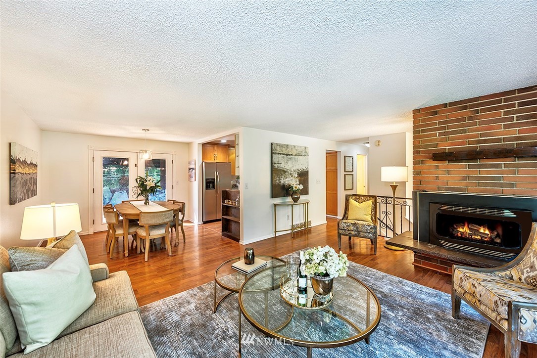 23002 Atlas Road Bothell, WA 98021 - Photo 5 of 23 a living room with furniture and a fireplace