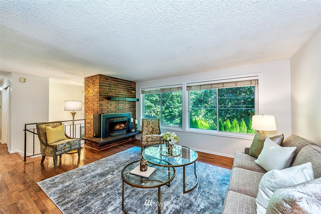 23002 Atlas Road Bothell, WA 98021 - Photo 7 of 23 a living room with furniture and a fireplace