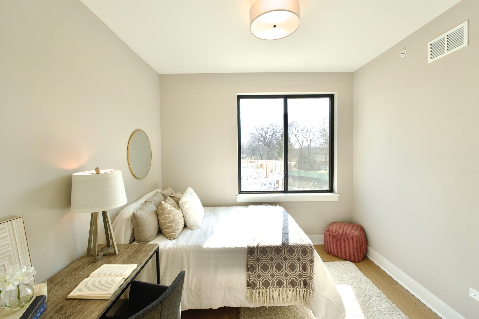 183 Pointe Drive, Unit 183 Northbrook, IL 60062 - Photo 17 of 23 a bed sitting in a bedroom next to a window