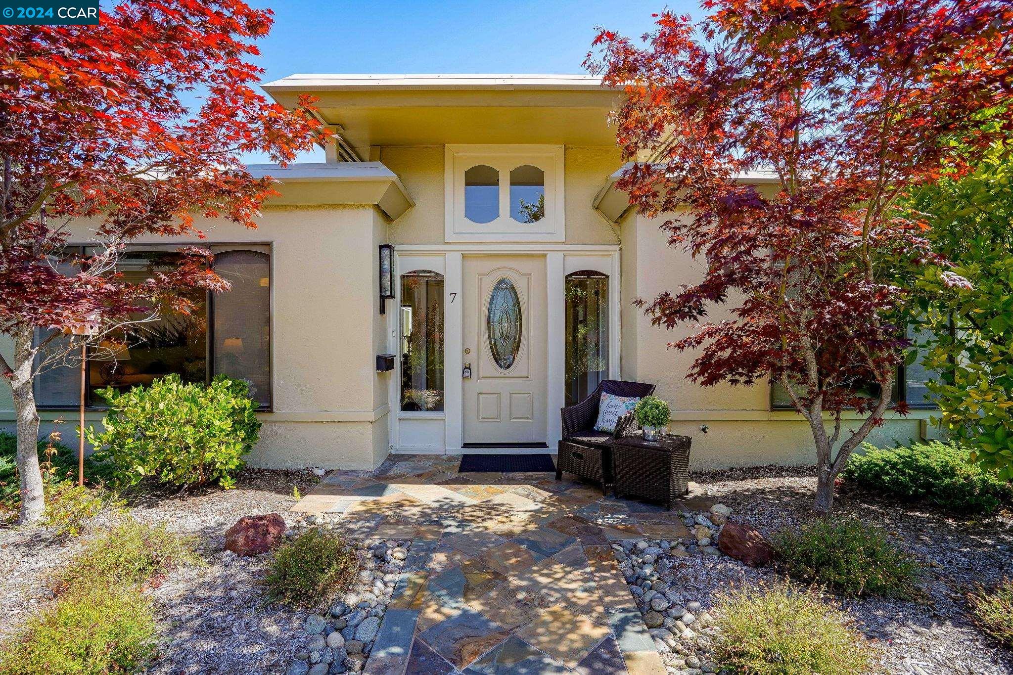 a front view of a house with a yard