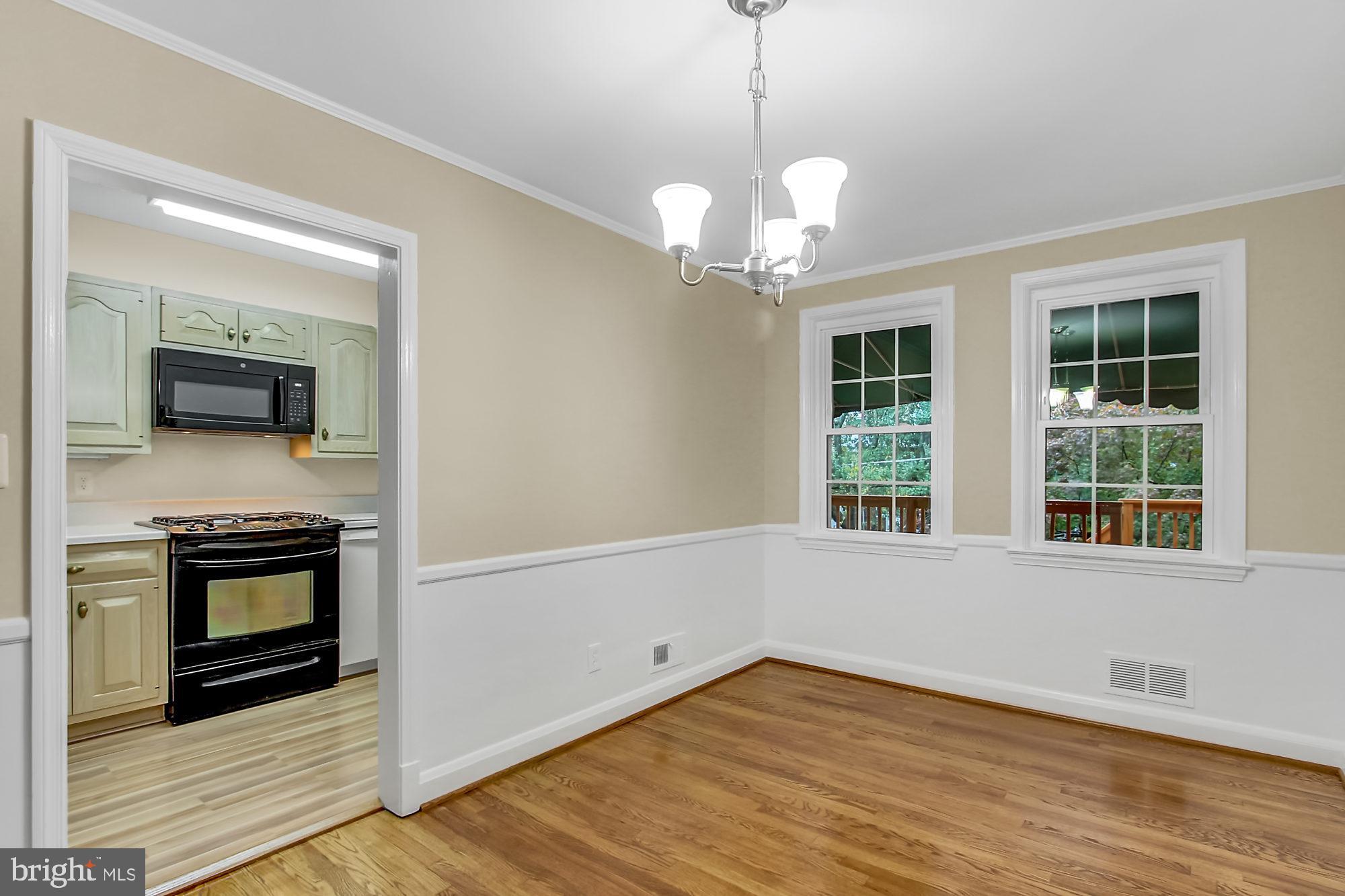 1629 Hardwick Road Baltimore, MD 21286 - Photo 5 of 22 Refinished hardwood floors & new light fixture