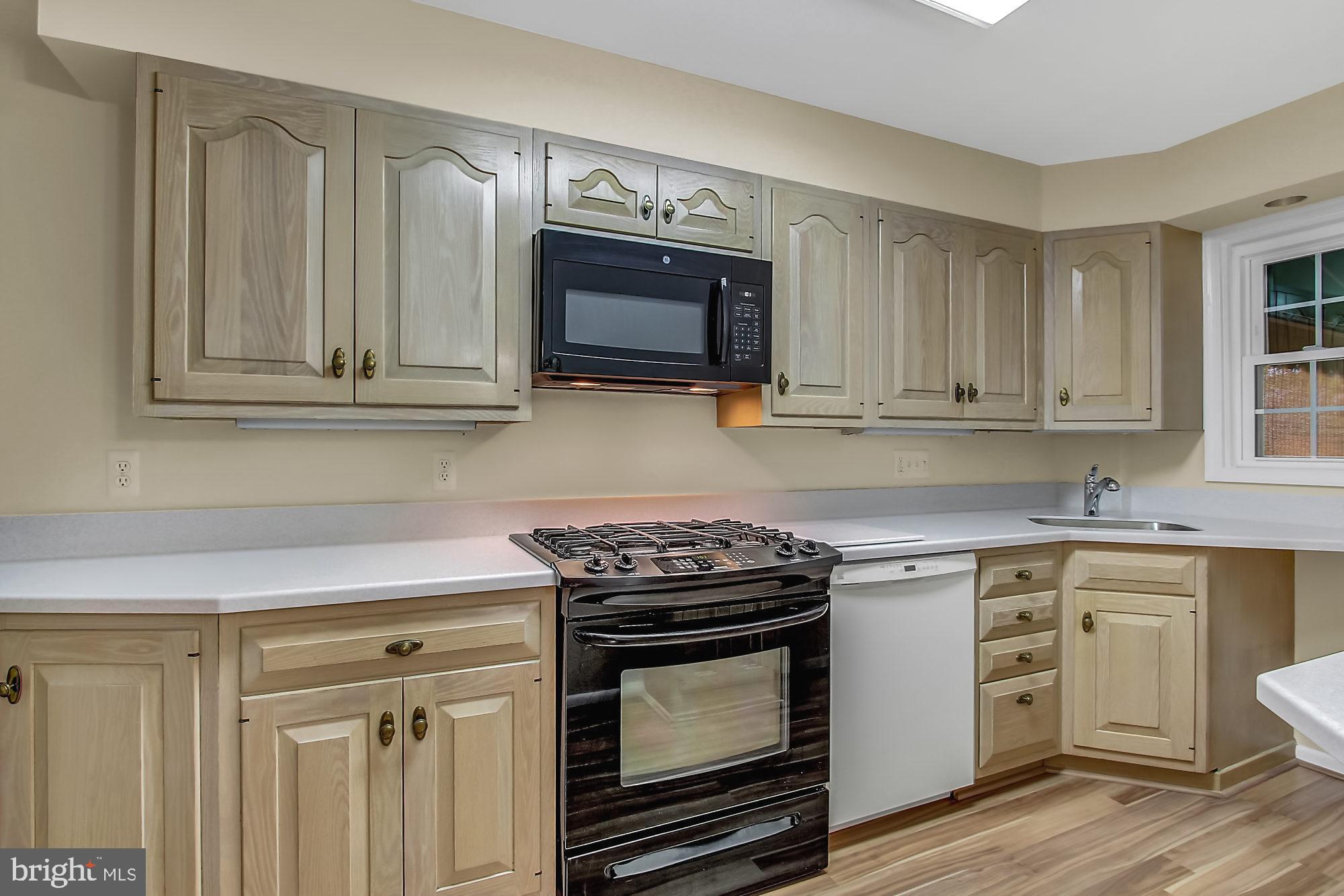 1629 Hardwick Road Baltimore, MD 21286 - Photo 8 of 22 Kitchen features new solid surface neutral counter