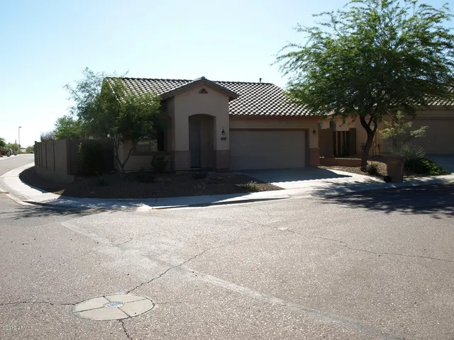 a view of a house with a yard and garage