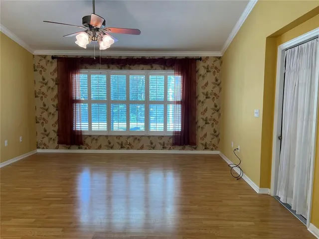 a large kitchen with cabinets and stainless steel appliances