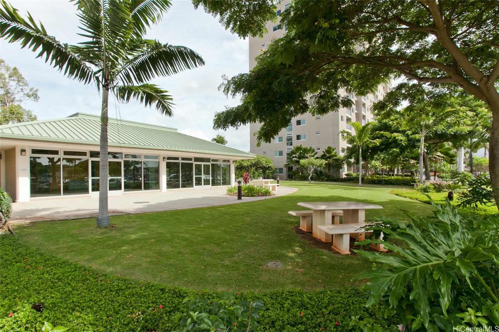 94-302 Paiwa Street, Unit 202 Waipahu, HI 96797 - Photo 12 of 12 a view of a house with a swimming pool