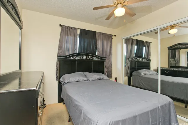 a bedroom with a bed and furniture