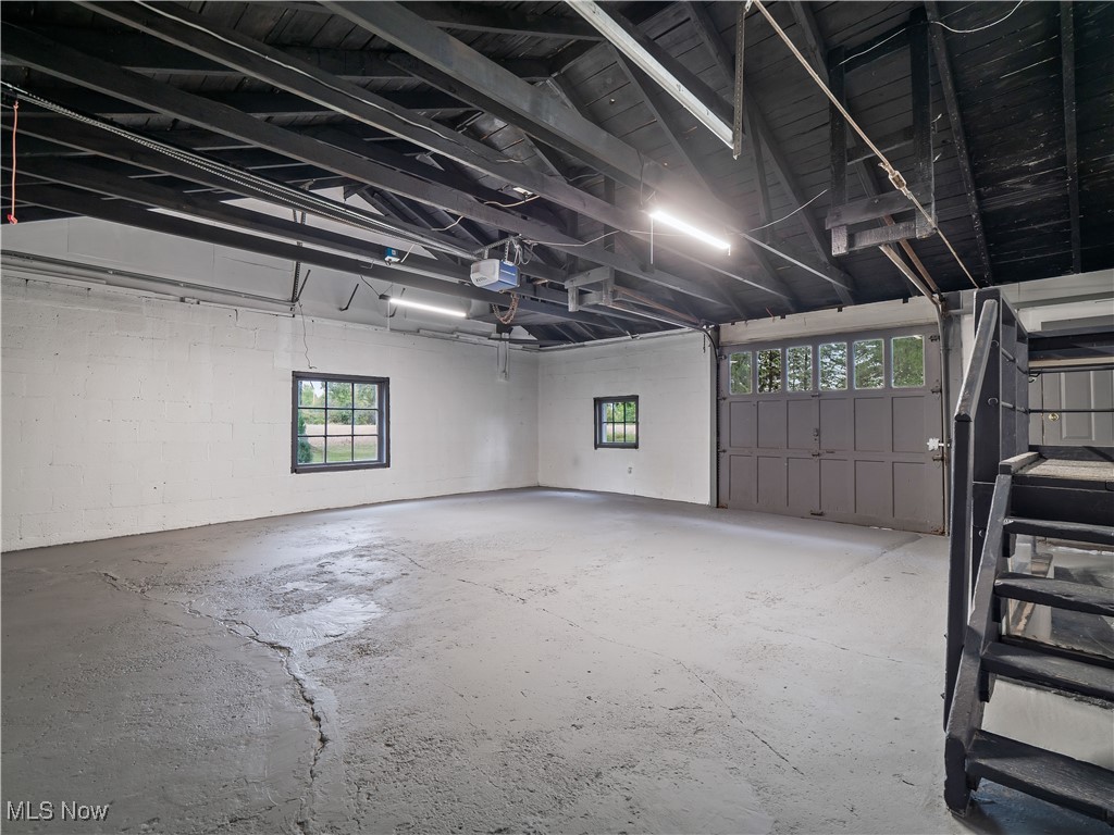 3605 Center Road Avon, OH 44011 - Photo 23 of 34 Garage with rear garage door and a garage door opener