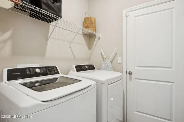 a utility room with dryer and washer